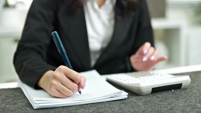 Tax deduction planning. Businesswoman calculate business balance prepare tax reduction..