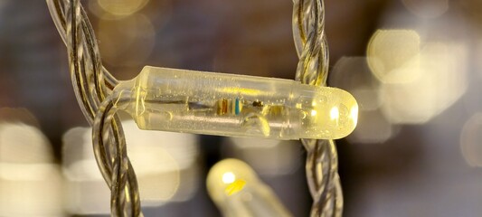 Close-up image of a light-emitting diode (LED) string light.LED string lights are popular for...