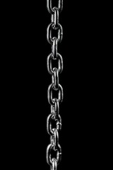 Obraz premium Close up of a silver metal chain against a black backdrop