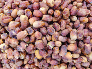 Abundance of sweet dried dates for healthy snacks and Middle Eastern cuisine, food background