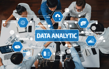 A diverse group of professionals collaborates on data analytics using modern tools and technology, analyzing big data and statistics in a dynamic office environment. Amity