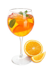 Glass of refreshing spritzer cocktail with mint and orange slices isolated on white