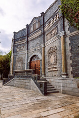 Naklejka premium Historic stone facade with ornate entrance in Gubei Water Town China