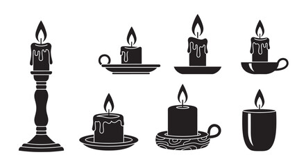 Black Candles Burning in Various Holders on White Background