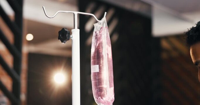 Healthcare, nurse and man with iv drip, hands and vitamin b with wellness, detox and treatment. Closeup, medical service or person with electrolytes, supplements or antibiotics with medicine or fluid