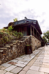 Gubei Water Town stone gate tower in China. Vertical photo