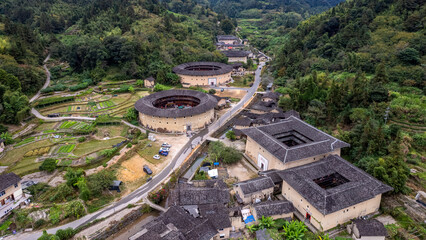 Aerial View of Traditional Round Houses in Forested Village