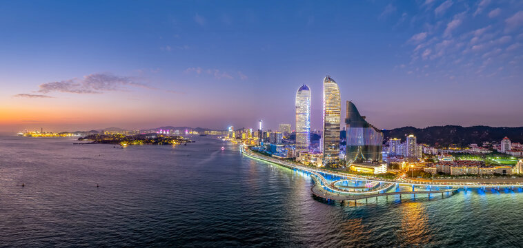 Evening View of Coastal City Skyline with Skyscrapers