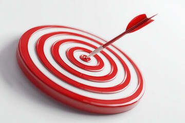 Target with red and white circles and arrow hitting the center on a plain background