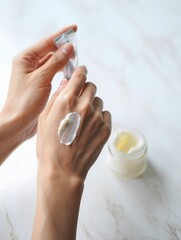 Applying Moisturizer - Close-up of Hands and Skincare Product
