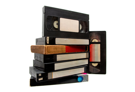 Stack of vintage VHS tapes on white
