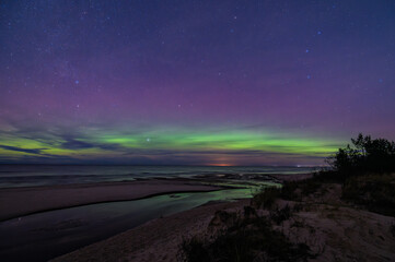 Aurora borealis northern lights over Baltic Sea in Latvia