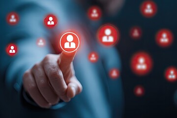 Close-up of a finger pressing a glowing human icon with other icons in the background