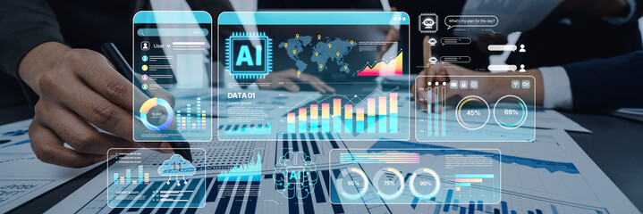 A high-tech business meeting scene featuring hands working with digital screens displaying...