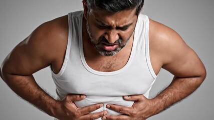 Man Experiencing Severe Stomach Pain Relieving Discomfort with Natural Remedies