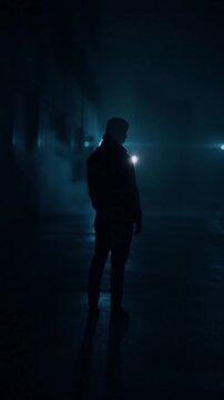 Cinematic digital silence concept showing a lone human silhouette in a dark urban environment with subtle neon light. Minimal noir atmosphere representing isolation, technology dominance and modern