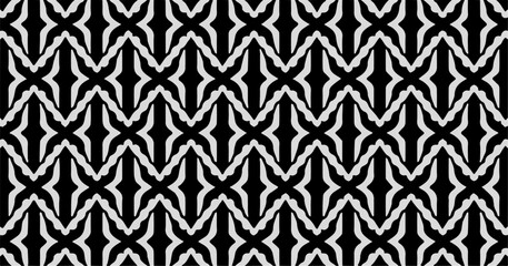 Seamless black and white geometric pattern with repeating abstract motifs, ideal for backgrounds, textiles, wallpapers, and modern graphic designs.