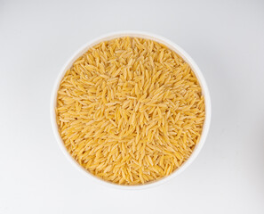 Raw orzo pasta, risoni or kritharaki pile
