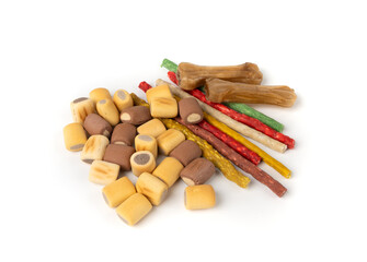 Assorted dog kibble, many canine food, different color dry pet food mix, various dog snack pile