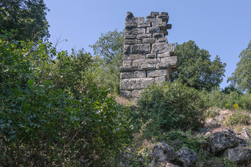 Ruins of the city of Termessos. An ancient city located high in the mountains of Turkey. The walls of the buildings in the ancient city are made of huge stone blocks. Masonry of ancient buildings.