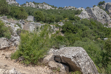 Ruins of the city of Termessos. An ancient city located high in the mountains of Turkey. The walls of the buildings in the ancient city are made of huge stone blocks. Masonry of ancient buildings.