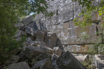 Ruins of the city of Termessos. An ancient city located high in the mountains of Turkey. The walls of the buildings in the ancient city are made of huge stone blocks. Masonry of ancient buildings.