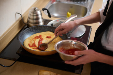 Cooking Pancake With Jam In Pan: Kitchen Scene, Hands Stirring Topping