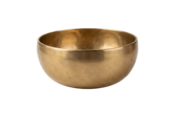 A solitary, gleaming brass singing bowl rests in isolation against a stark white backdrop, evoking a sense of tranquility and mindfulness