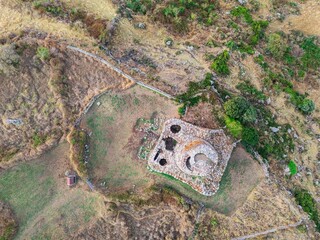 Aerial view of Nuraghe Santa Barbara ancient stone ruins. Macomer, Sardinia, Italy