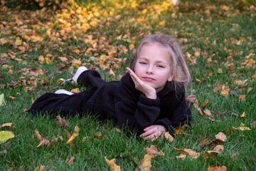 little girl lying on the grass