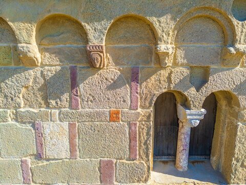 Romanesque stone fa&ccedil;ade detail with arches and small doorway. Church of Santa Maria di Sibiola in Serdiana, Sardinia, Italy