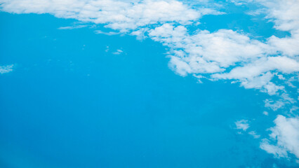 White clouds floating over rural farmland