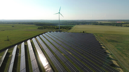 Renewable energy farm with solar panels and windmill