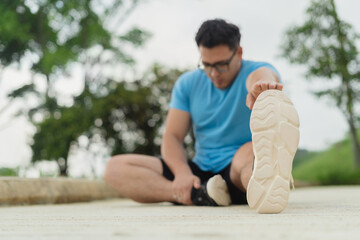 Man doing morning stretching outdoors to start the new year focused on wellness and personal growth