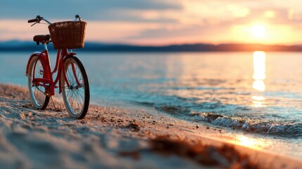 A vintage bicycle with a basket rests peacefully on the sandy beach as the sun sets, creating a serene atmosphere and inviting leisurely reflection and tranquility.