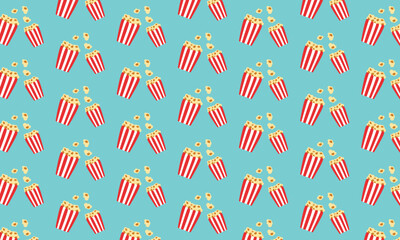 Seamless retro popcorn pattern on blue background, classic cinema snack design, movie night wrapping paper