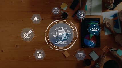 A marketing automation strategy session featuring visual data analysis, interactive charts, and team collaboration on a wooden table, emphasizing technology and growth. Raster - Powered by Adobe