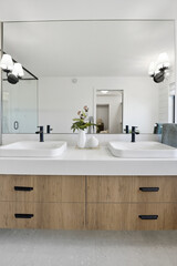 Bathroom with two sinks and a mirror