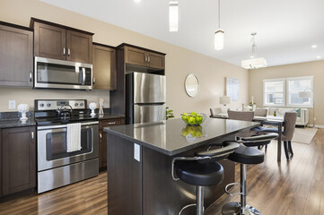 Kitchen with a stainless steel stove and microwave, a refrigerator
