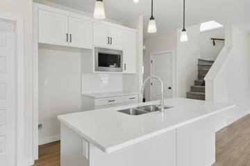 Kitchen with a white countertop and a sink