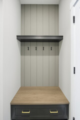 Small room with a wooden table and a shelf