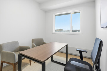 Small office with a desk and two chairs