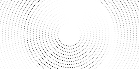 Minimalist abstract image featuring concentric dotted circles in shades of grey on a light background, creating a modern and tech-inspired circular pattern. © towilah