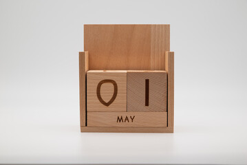 1st May - International Workers' Day. Wooden calendar on the white background. 