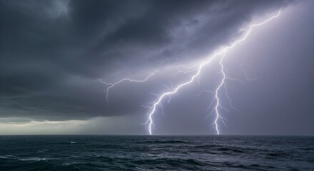Lightning striking over ocean waters during stormy weather  