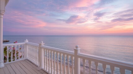 Fototapeta premium Panoramic View From Balcony of Luxury Resort Overlooking the Ocean With Pastel Sky During Sunset