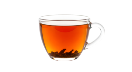 Clear glass cup filled with hot tea and tea leaves