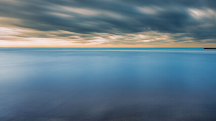 Fototapeta premium summer sunrise over the lagoon meets the sea, Bibione Pineda, Venice, Italy