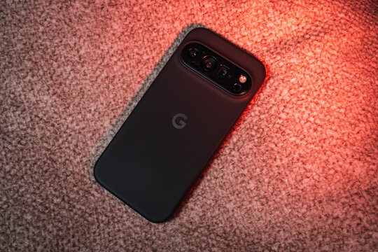 TALLINN, ESTONIA - December 13, 2025: Google Pixel 10 Pro smartphone with a protective case, showing the camera bar and 'G' logo, resting on a textured carpet.