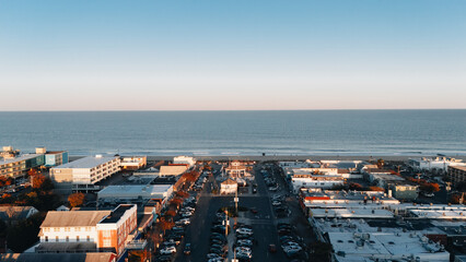Aerial view of the town on the ocean. Beach town. Coastal town. Autumn on the beach. Summer sunset on the ocean beach.  © Cherry